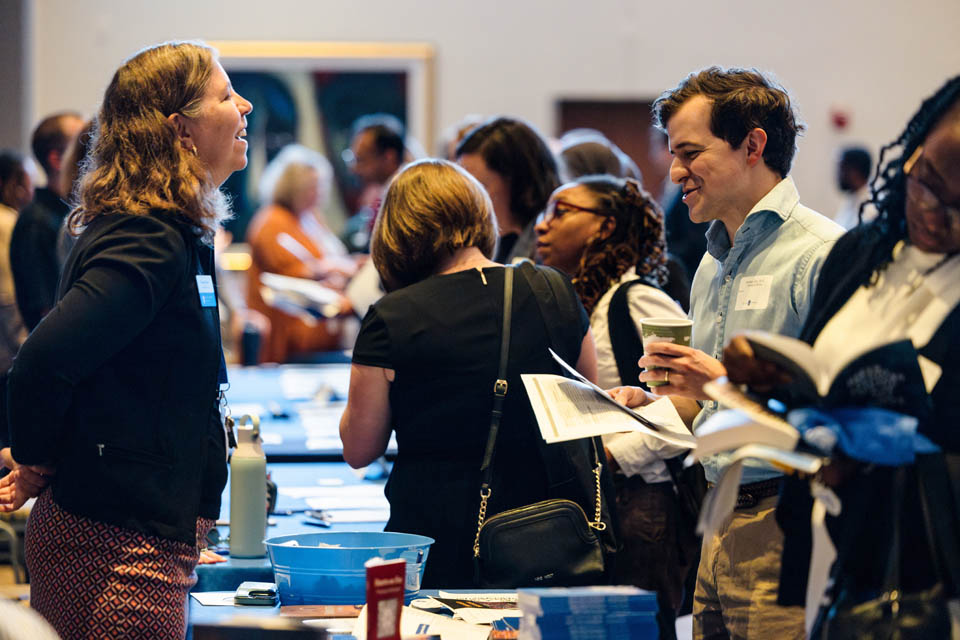New faculty members explore the resource fair during the new faculty orientation on Wednesday, Aug. 16. Photo by Sarah Conroy.