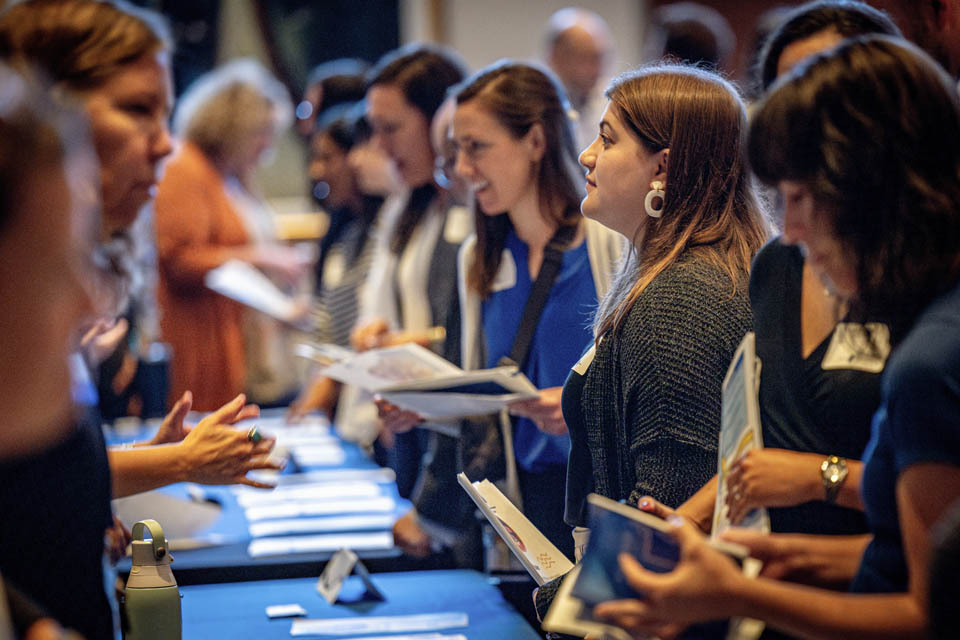 New faculty members explore the resource fair during the new faculty orientation on Wednesday, Aug. 16. Photo by Sarah Conroy.