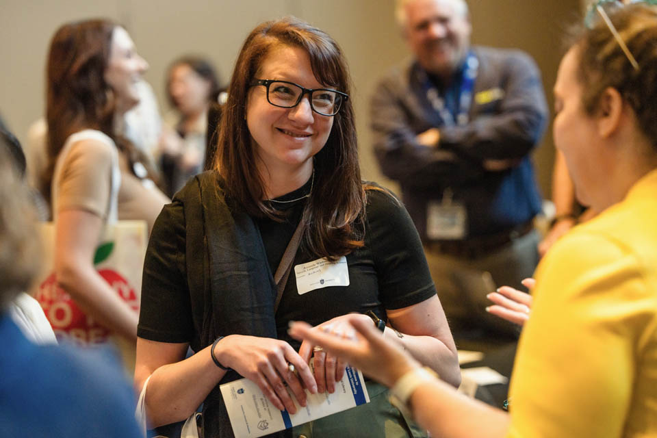 New faculty members explore the resource fair during the new faculty orientation on Wednesday, Aug. 16. Photo by Sarah Conroy.