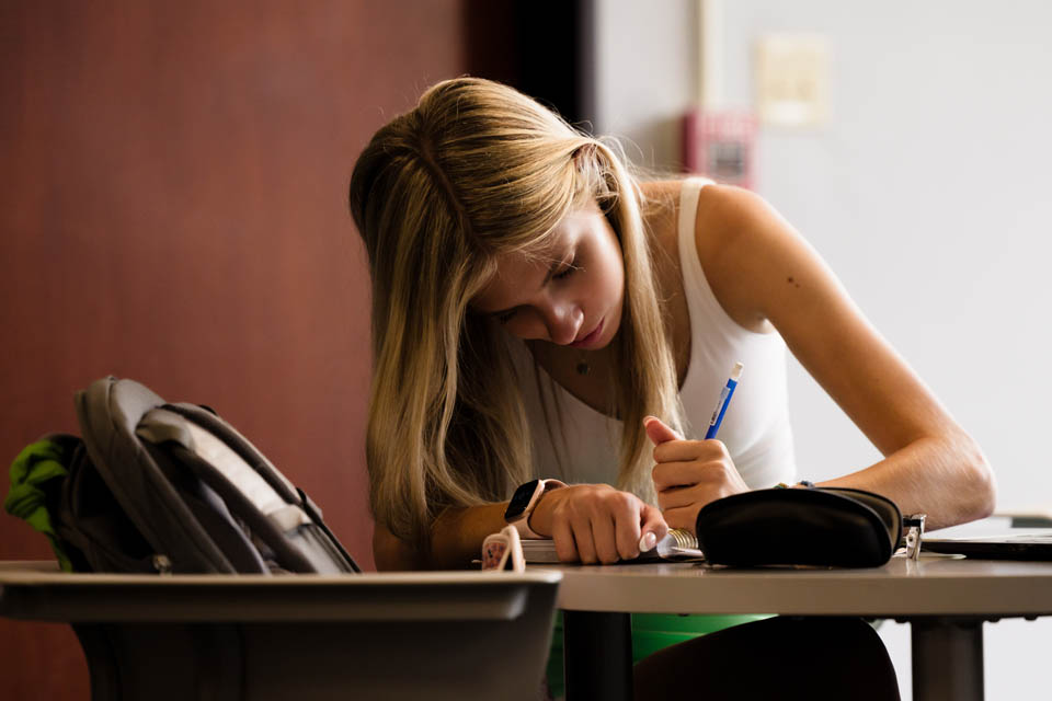 A student studies in Fitzgerald Hall on the first day of classes on Wednesday, Aug. 23. Photo by Sarah Conroy.