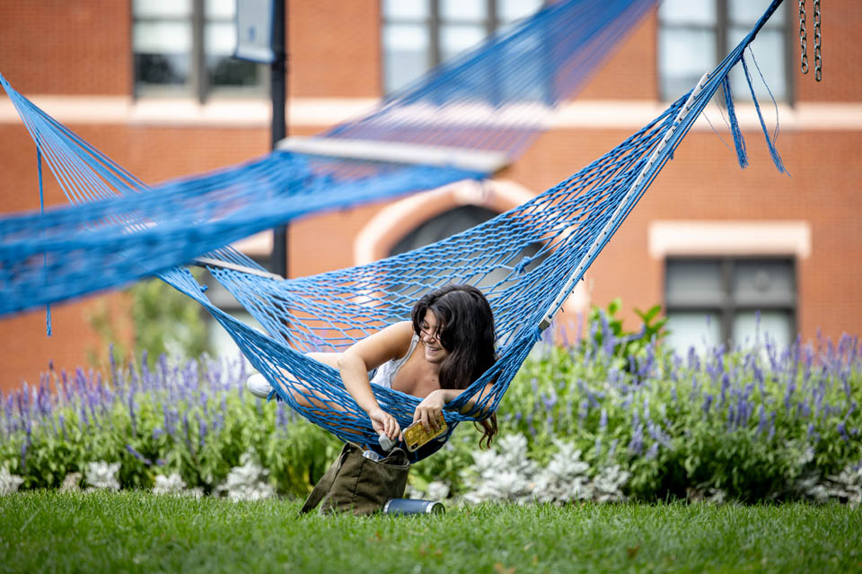 A student relaxes in a hammock after the first day of classes on Wednesday, Aug. 23. Photo by Sarah Conroy. 
