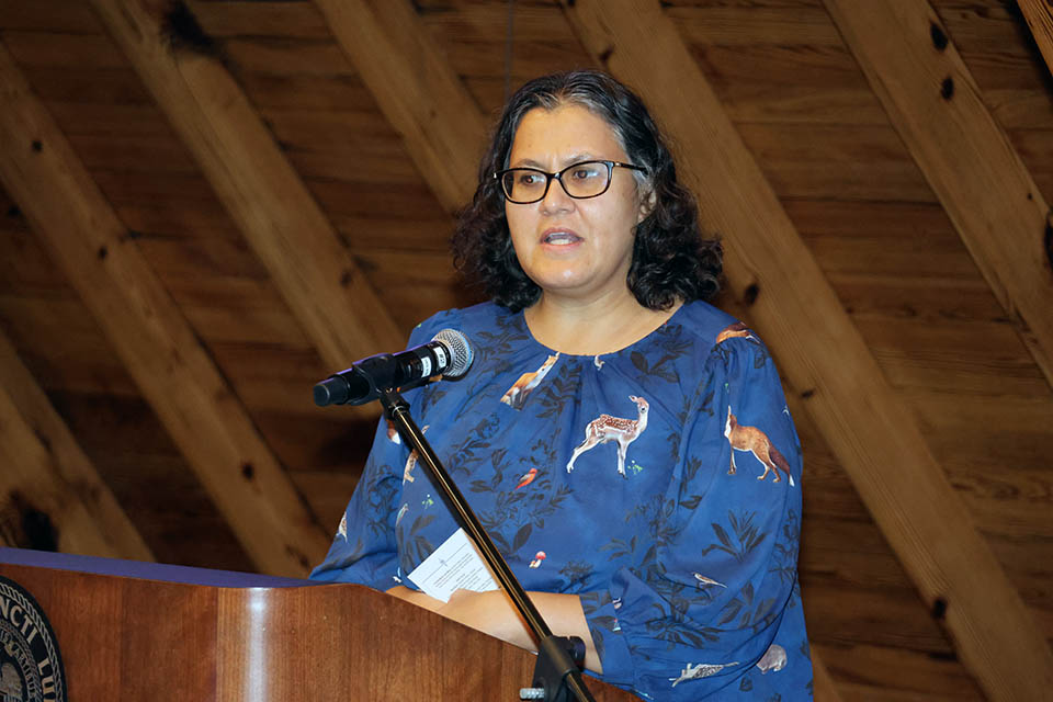 Helen de Cruz, Ph.D., accepted her Scholarly Works as Public Works award at the 2023 Scholarly Works reception on Thursday, Sept. 14. Not pictured is fellow recipient Pauline Lee, Ph.D. Photo by Joe Barker.