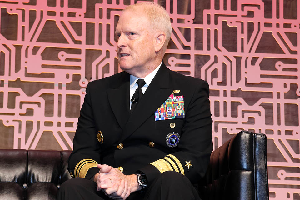 Vice Admiral Frank Whitworth talked about his role at the National Geospatial-Intelligence Agency during the opening panel of the Geo-Resolutions conference. Photo by Joe Barker. 
