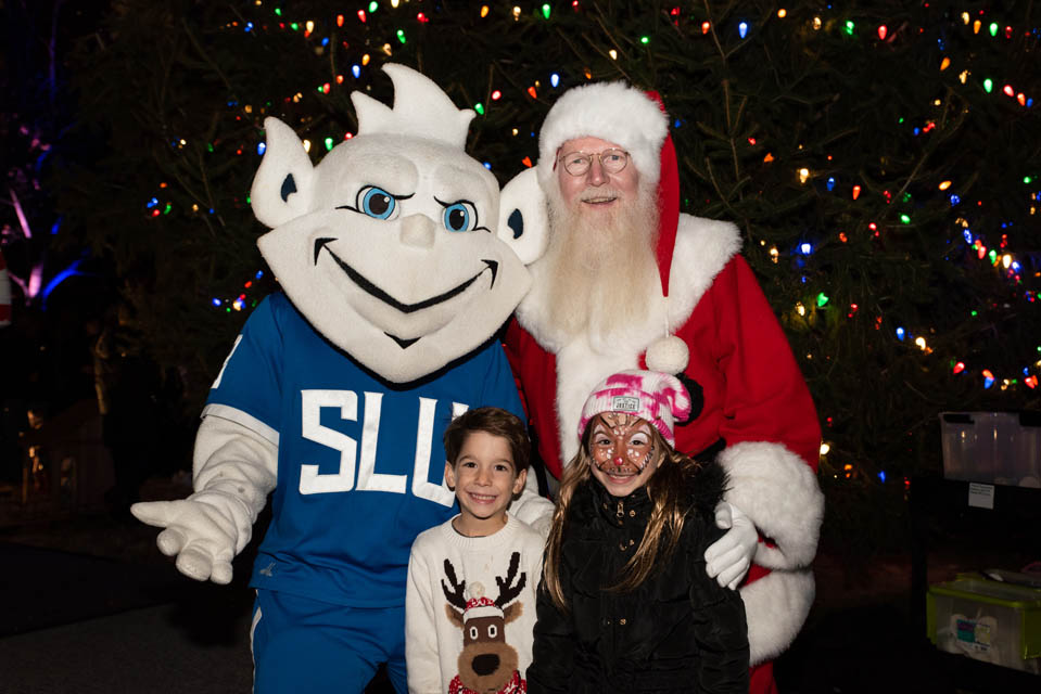 Santa and the Billiken pose for pictures with visitors at Christmas on the Quad on Saturday, Dec. 9. Photo by Luke Yamnitz.