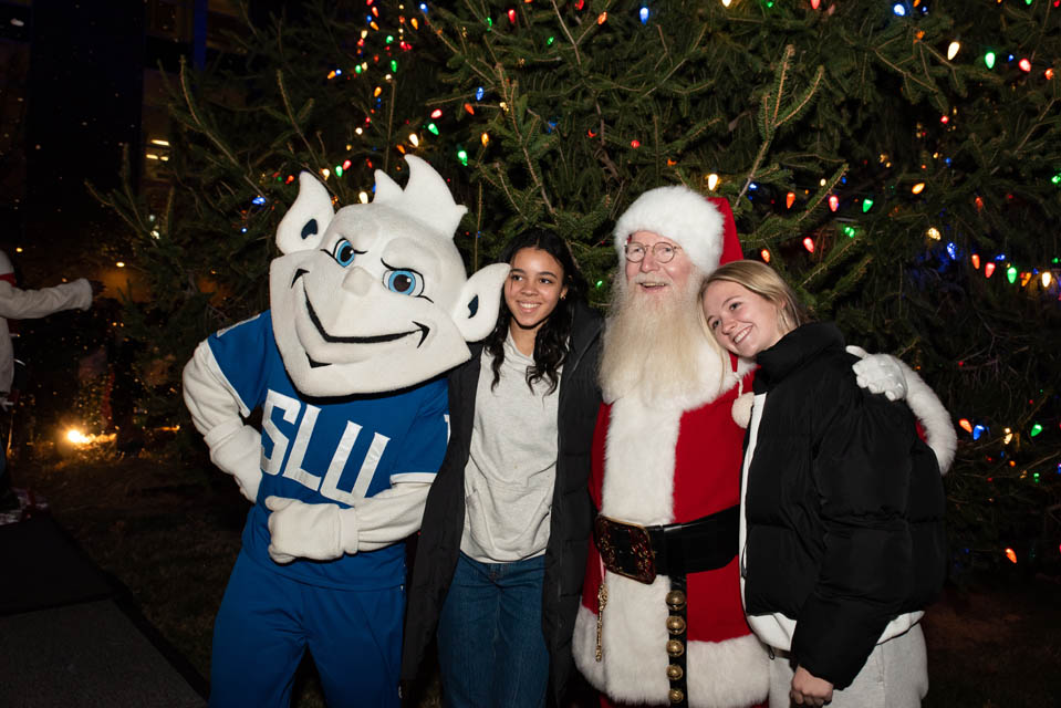 Santa and the Billiken pose for pictures at Christmas on the Quad on Saturday, Dec. 9. Photo by Luke Yamnitz.