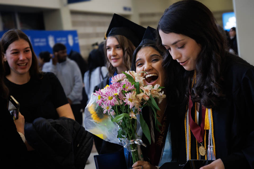 Graduates celebrate with their loved ones after the Midyear Commencement on Saturday, Dec. 16, 2023. Photo by Sarah Conroy.