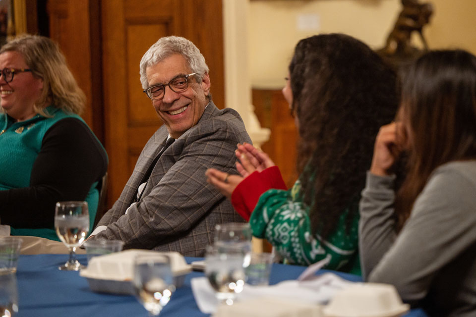 Saint Louis University President Fred P. Pestello, Ph.D., talks with his seminar students on Dec. 9, 2022. Photo courtesy of Saint Louis University. 