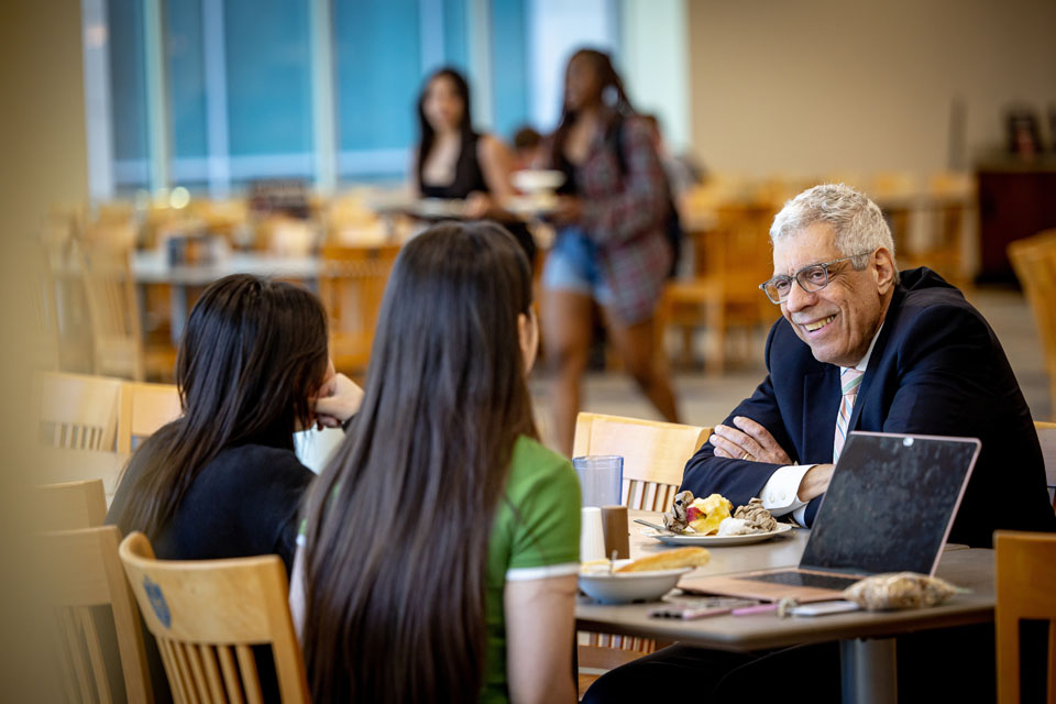 Saint Louis University President Fred P. Pestello, Ph.D., lunches with students on April 11, 2023, in SLU’s Grand Dining Hall. Photo courtesy of Saint Louis University. 