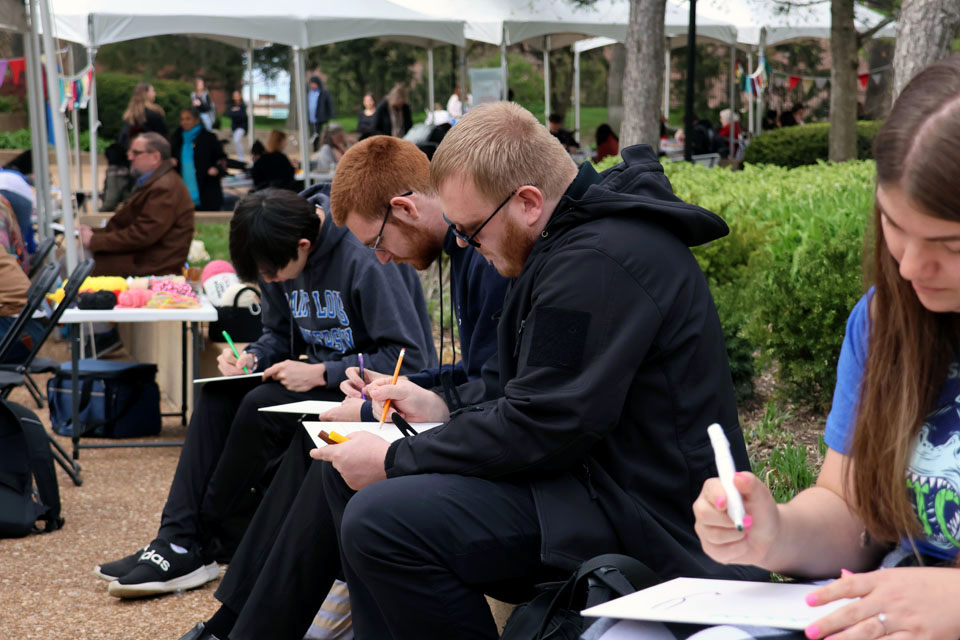 Students work on art during the Art Hives pop-up event on Friday, April 5. Photo by Joe Barker.