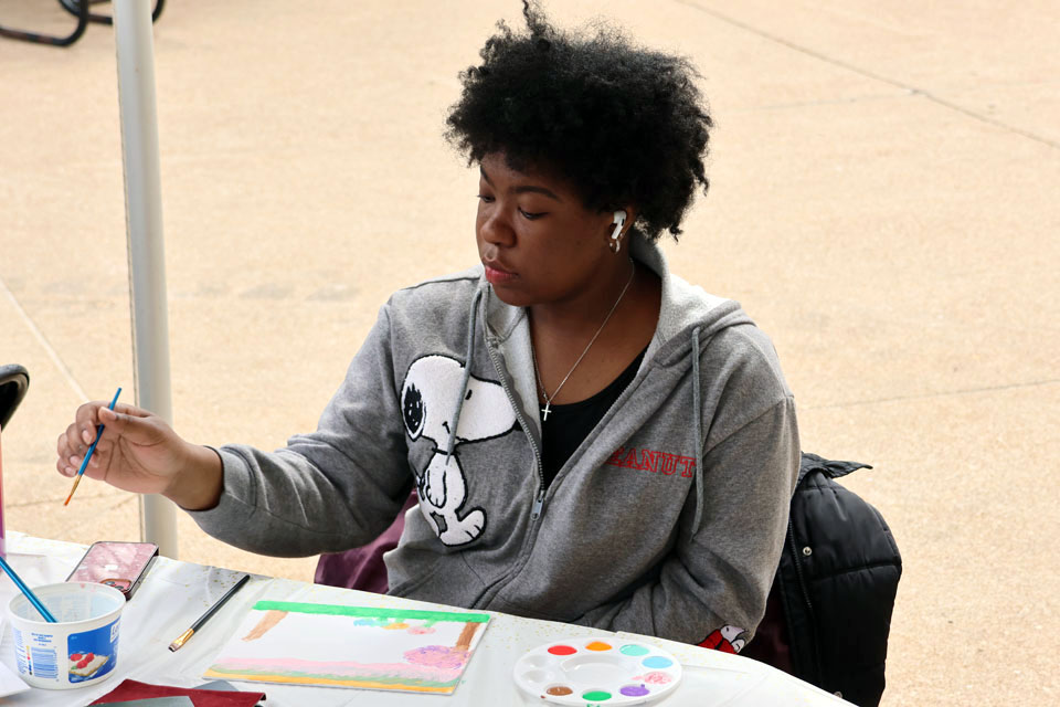 A student paints during Art Hives on Friday, April 5. Photo by Joe Barker.