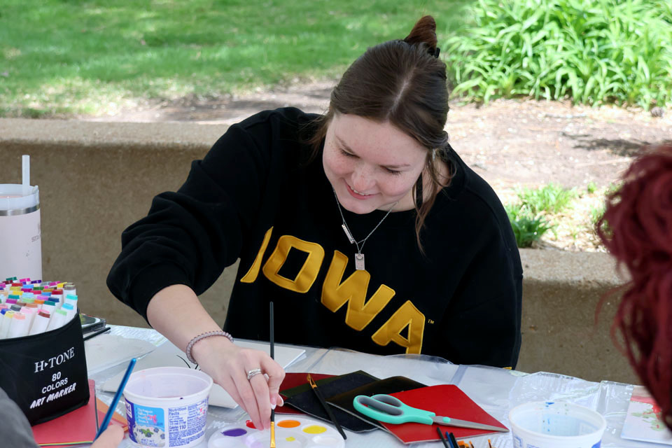 A student paints during Art Hives on Friday, April 5. Photo by Joe Barker.