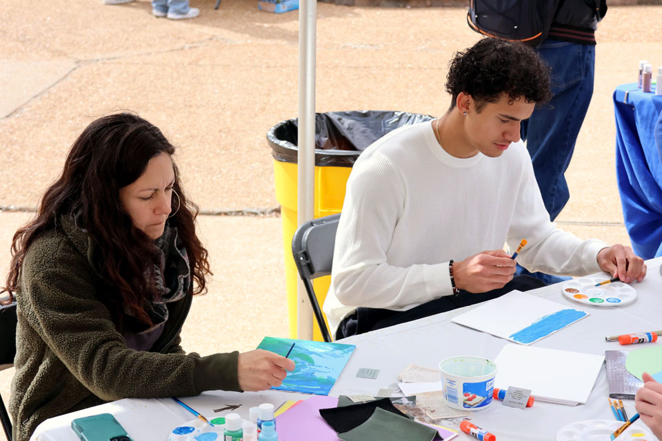 Students paint during Art Hives on Friday, April 5, 2024. Photo by Joe Barker.