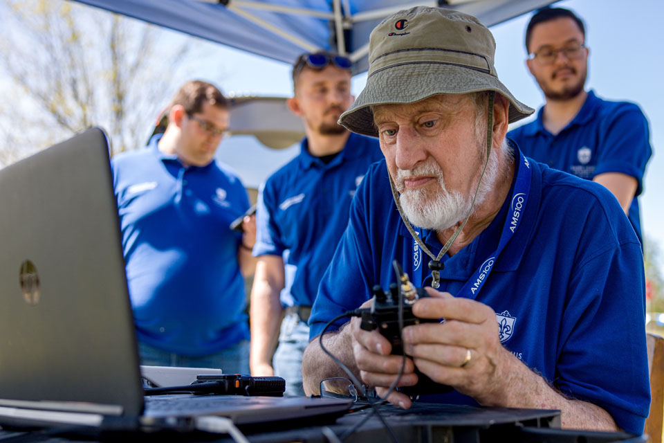 Robert Pasken, Ph.D., associate professor of meteorology, prepares equipment to launch weather balloons during the solar eclipse at Trail of Tears State Park on April 8, 2024. Photo by Sarah Conroy. 
