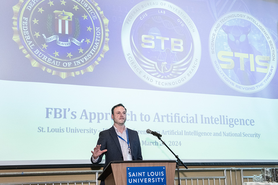 An FBI representative speaks at the Artificial Intelligence and National Security Symposium. Photo by Steve Dolan.
