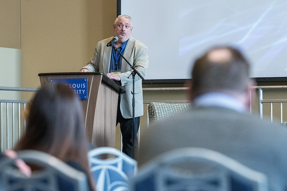 Robert Rahmer, director of the Office of Analysis Research, Intelligence Advanced Research Projects Activity (IARPA) addresses the AI and National Security Conference at SLU. Photo by Steve Dolan.