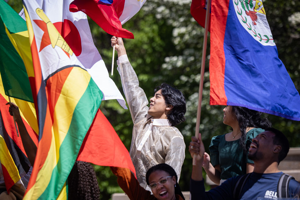 Members of the SLU community wave flags during the Parade of Nations as part of Atlas Week on April 12, 2024. Photo by Sarah Conroy.