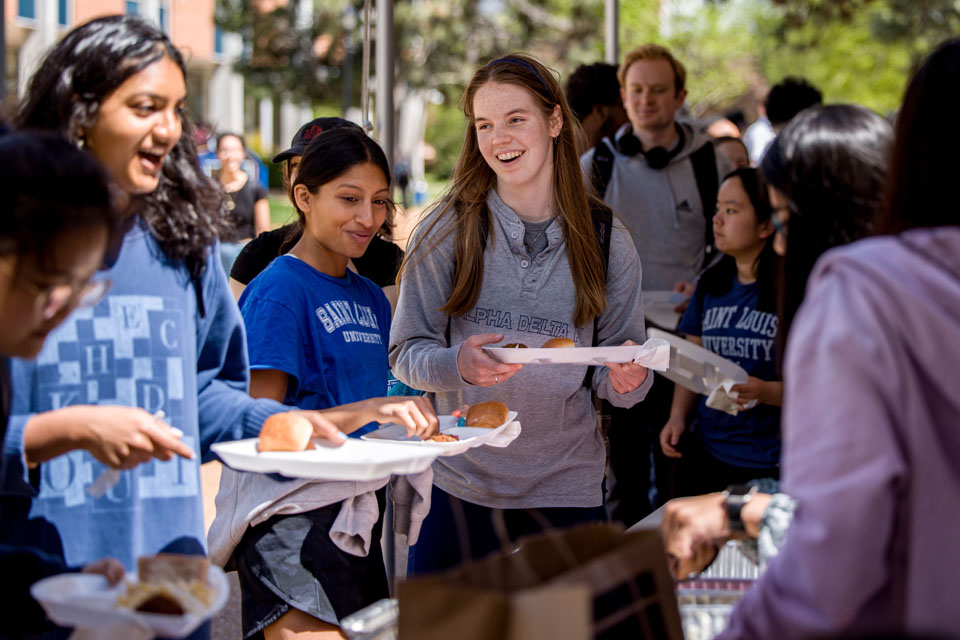 Students try different International cuisines at the Around the Globe: Clock Tower Market as part of Atlas Week on April 12, 2024. Photo by Sarah Conroy.  