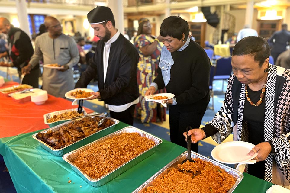 Special Assistant to SLU President Nicci Roach and other guests helped themselves to some Jollof-rice. Photo by Prisca Enedah.