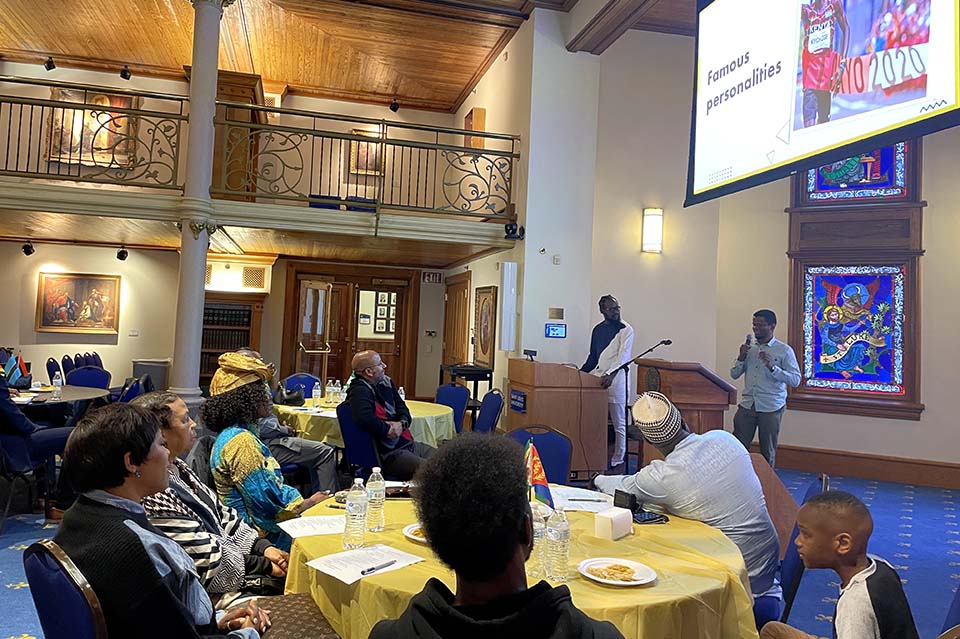 Invited guests listen to School of Engineering student, Imran Said gave a presentation about his home country, Kenya, and its culture. Photo by Prisca Enedah.