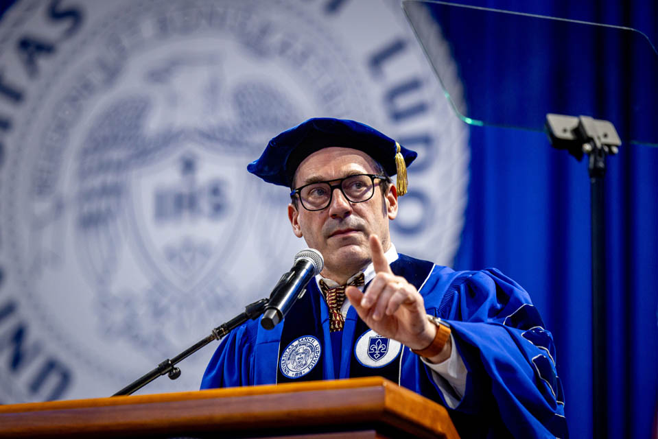 Commencement speaker Jon Hamm addresses the crowd at Chaifetz Arena on Saturday, May 18, 2024. Photo by Sarah Conroy. 