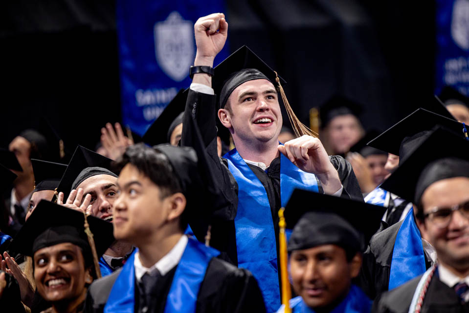 Graduates celebrate during Commencement on May 18, 2024. Photo by Sarah Conroy. 