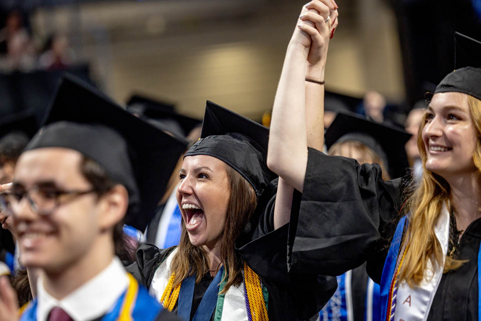 Graduates celebrate during Commencement on May 18, 2024. Photo by Sarah Conroy. 