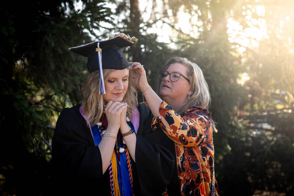 A graduate prepares for Commencement on May 18, 2024. Photo by Sarah Conroy. 