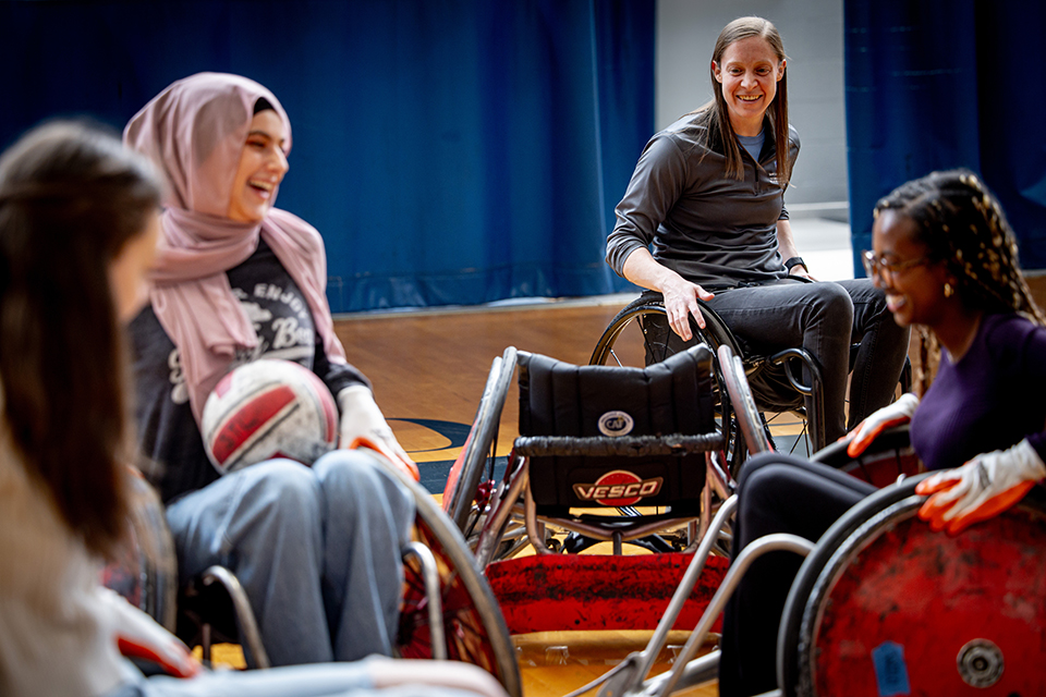 Sarah Adam, OTD, assistant professor of occupational science and occupational therapy at SLU, plays wheelchair rugby with her students during DASA (Disabled Athlete Sports Association) Day on April 22, 2024. Photo by Sarah Adam.
