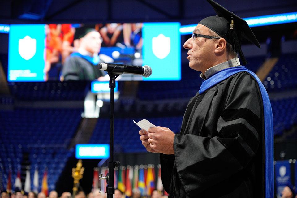 SLU faculty member and Billiken father Riyadh Hindi, Ph.D., speaks at the 2019 Fall Convocation at Chaifetz Arena. SLU file photo