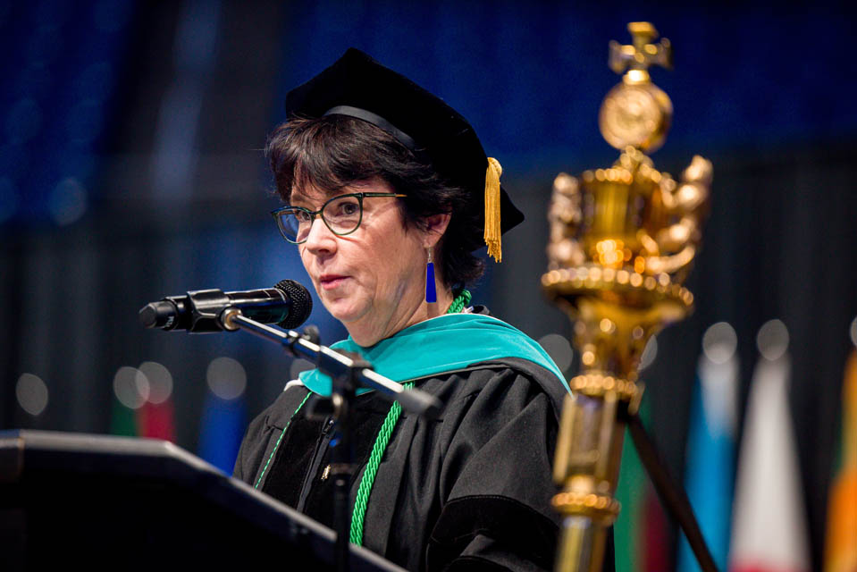Kim Levenhagen, DPT, professor of physical therapy and athletic training at the Doisy College of Health Sciences, addresses the incoming freshman class during Convocation on Aug. 17, 2024. Photo by Sarah Conroy. 


