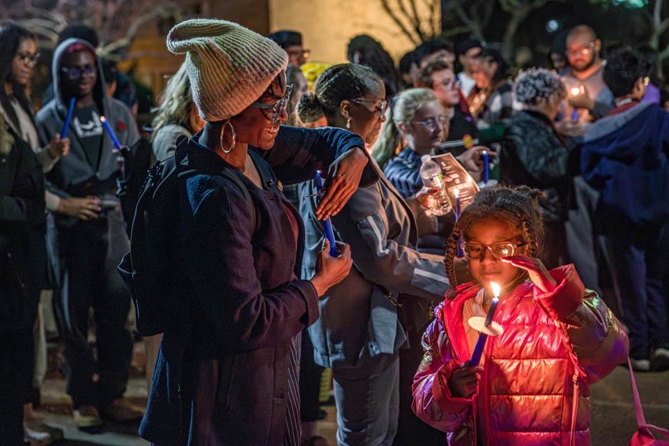 Attendees light candles during the Lights of Remembrance Candlelight Vigil on Thursday, Feb. 27, 2025. Photo by Sarah Conroy. 