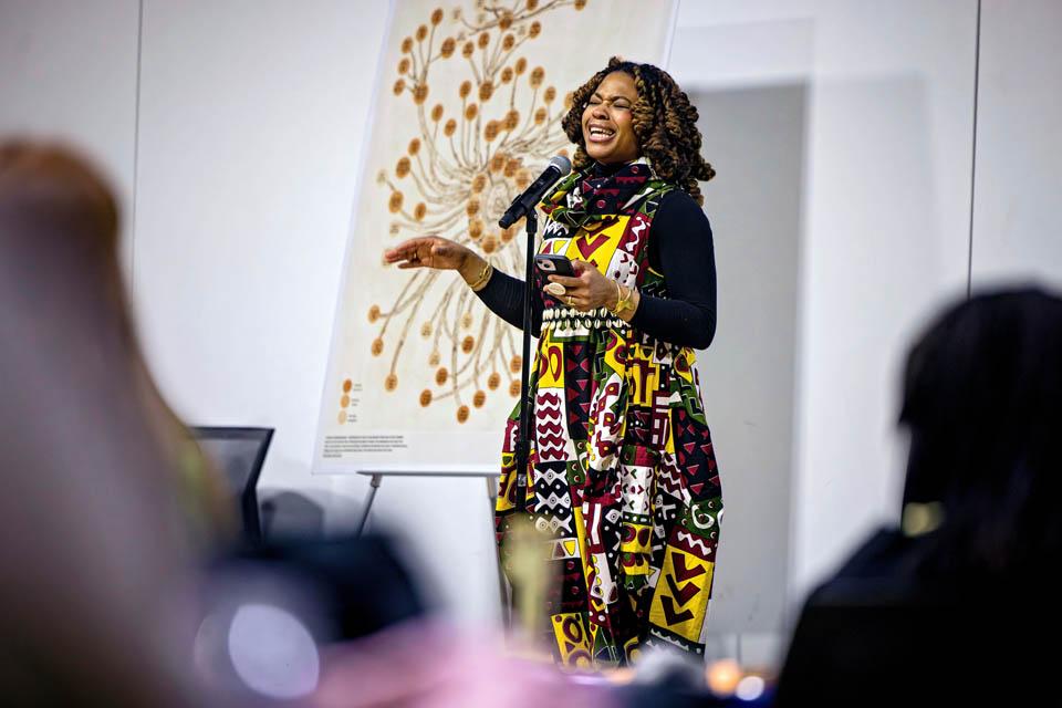 Poet InnerGy, recites a poem during the Lights of Remembrance Candlelight Vigil on Feb. 27, 2025. Photo by Sarah Conroy. 