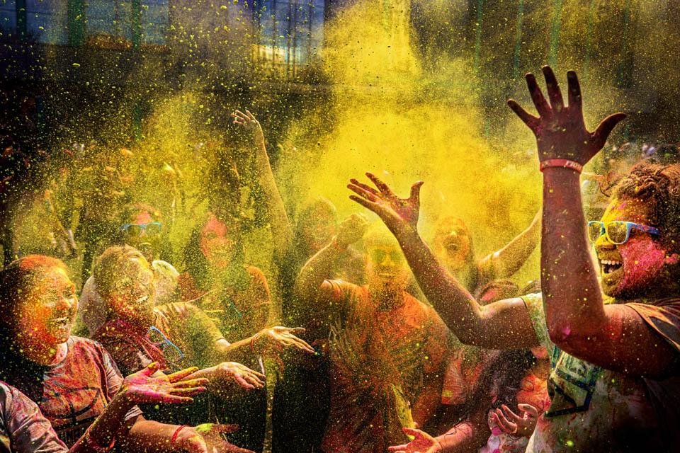 Students throw color in the air to celebrate Holi, the Hindu festival of colors, on March 22, 2025. Photo by Sarah Conroy.  
