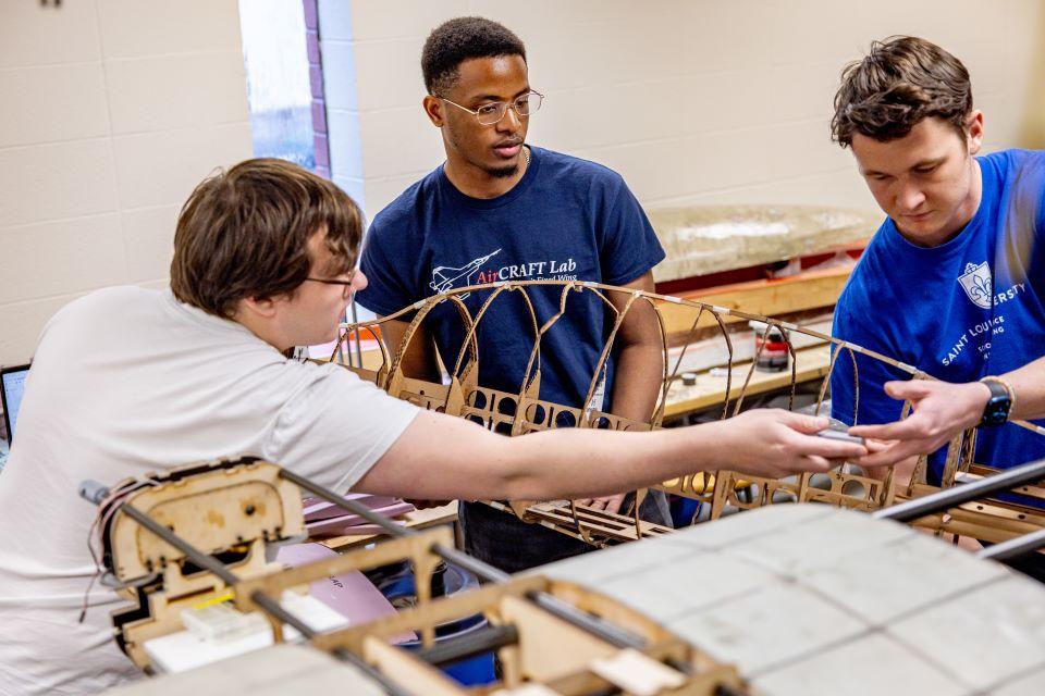 From left, Will Jameson, Chuka Okeke, and Ian Roudebush in the AirCRAFT Lab. Photo by Sarah Conroy.