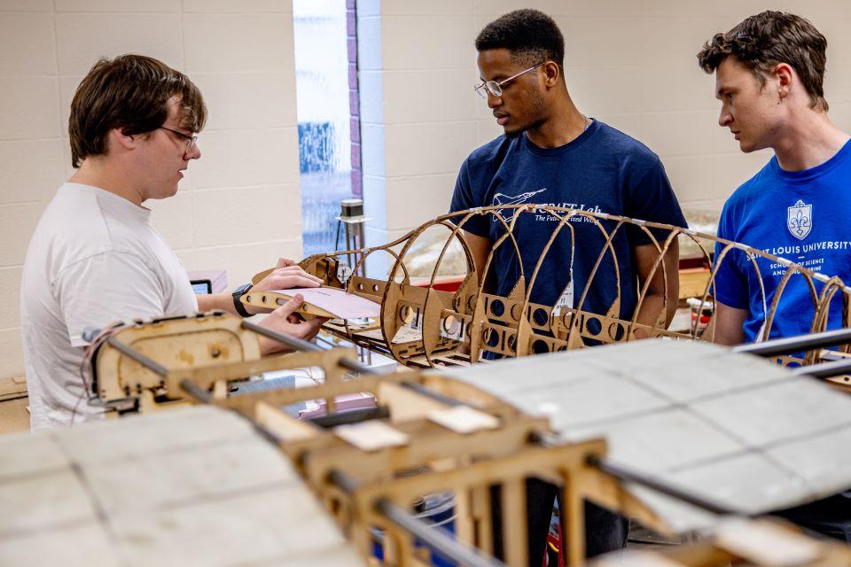From left, Will Jameson, Chuka Okeke, and Ian Roudebush in the AirCRAFT Lab. Photo by Sarah Conroy.