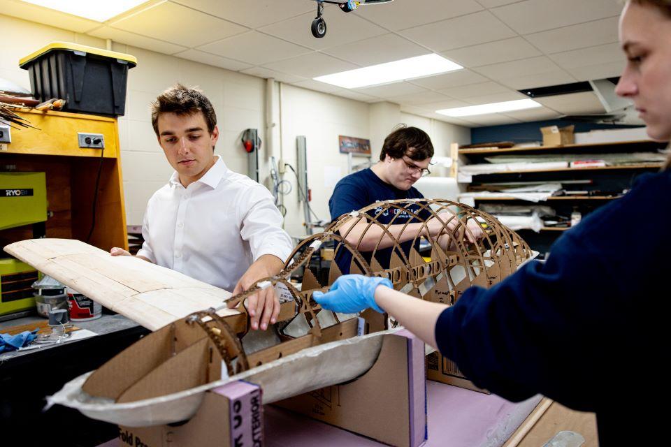 Nathan Mercier, Will Jameson and Mia Arndt in the AirCRAFT Lab. Photo by Sarah Conroy.