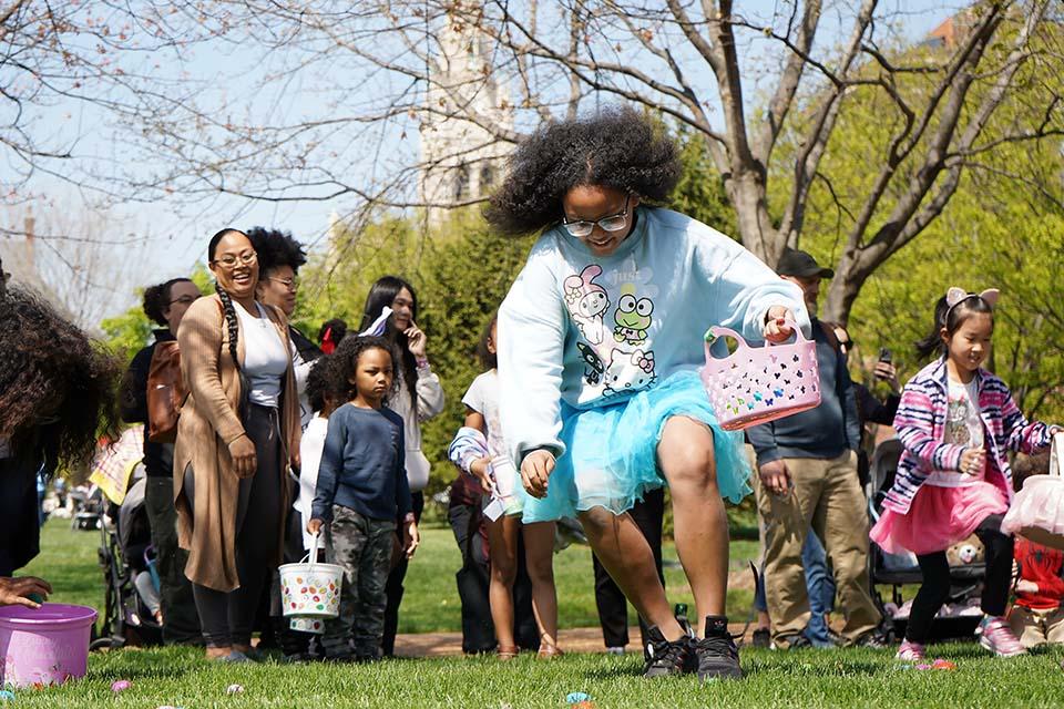 Children search for eggs during the Easter Egg Hunt.
