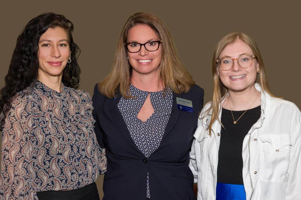 Elizabeth Salley, left, and Hayley Johnston, right, received the Sister Shirley Kolmer Memorial Grant at the Mary A. Bruemmer Recognition Ceremony on April 22, 2025. They are pictured with Women's Commission member Alexis Bruce-Staudt. Beatriz Jordá, not pictured, also received the grant. Photo by Sarah Conroy. 