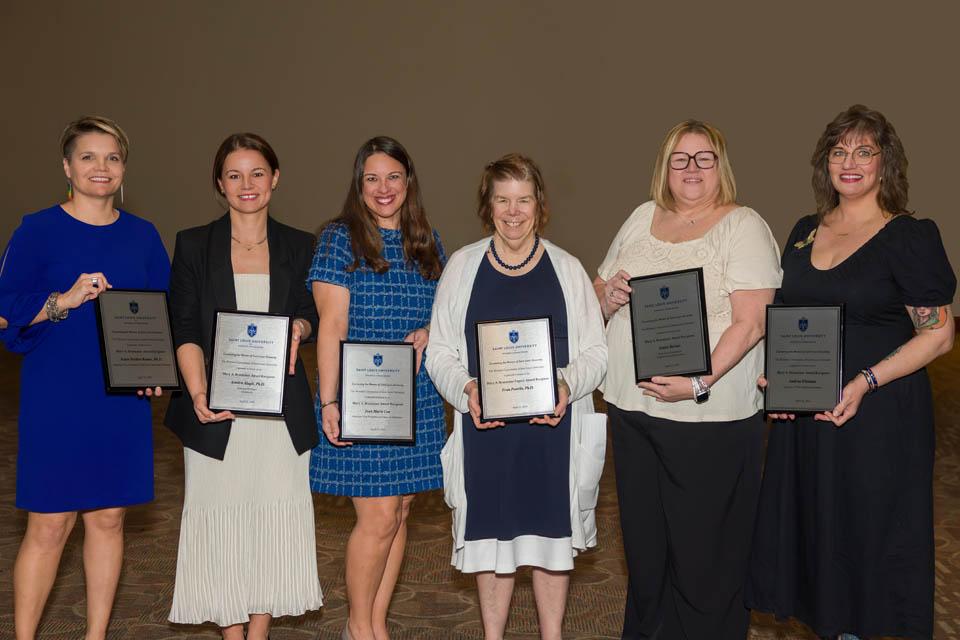 The 2025 Mary A. Bruemmer Recognition ceremony honored six members of the SLU community. They were, from left, Katie Heiden-Rootes, Ph.D.; Asmira Alagic, Ph.D.; Jean Marie Cox, Fran Pestello, Ph.D.; Janice Barnes, and Andrea Hitsman. Photo by Sarah Conroy.  
