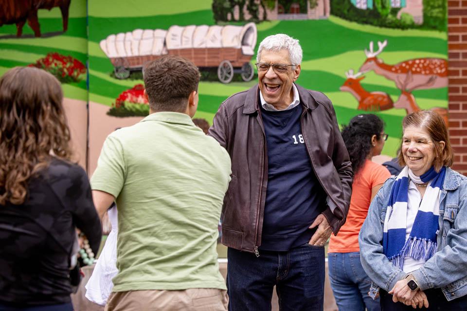 President Fred P. Pestello, Ph.D., and First Lady Fran Pestello, Ph.D., greet students during a celebration for the Pestellos with the SLU community at Grant’s Farm on April 27, 2025. Photo by Sarah Conroy.