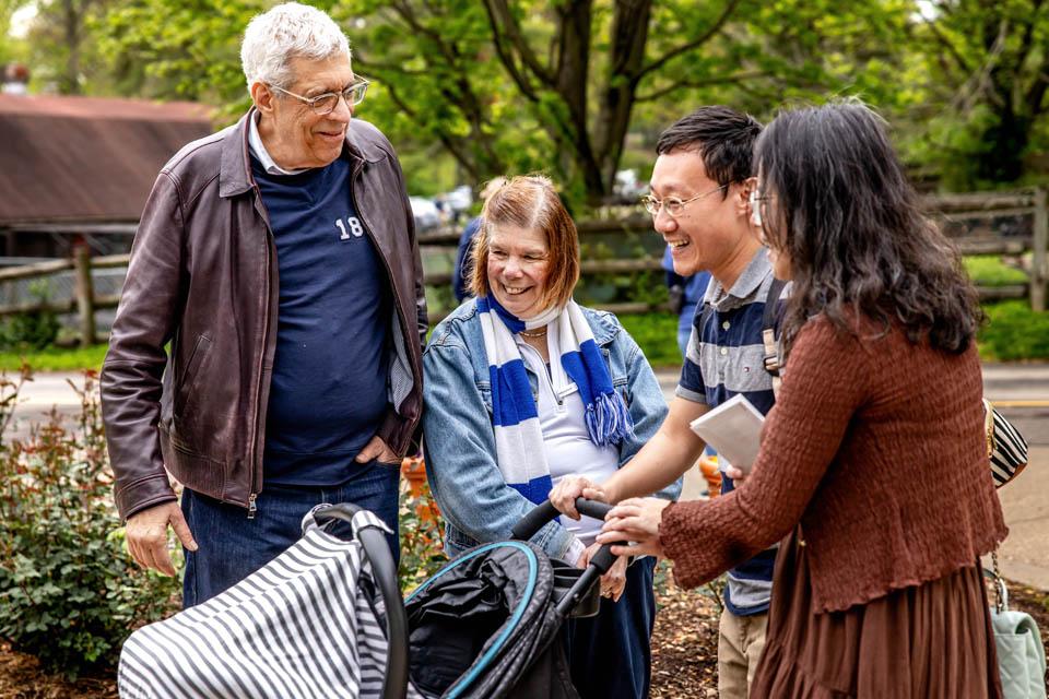President Fred P. Pestello, Ph.D., and First Lady Fran Pestello, Ph.D., greet faculty and staff families during a celebration for the Pestellos with the SLU community at Grant’s Farm on April 27, 2025. Photo by Sarah Conroy.