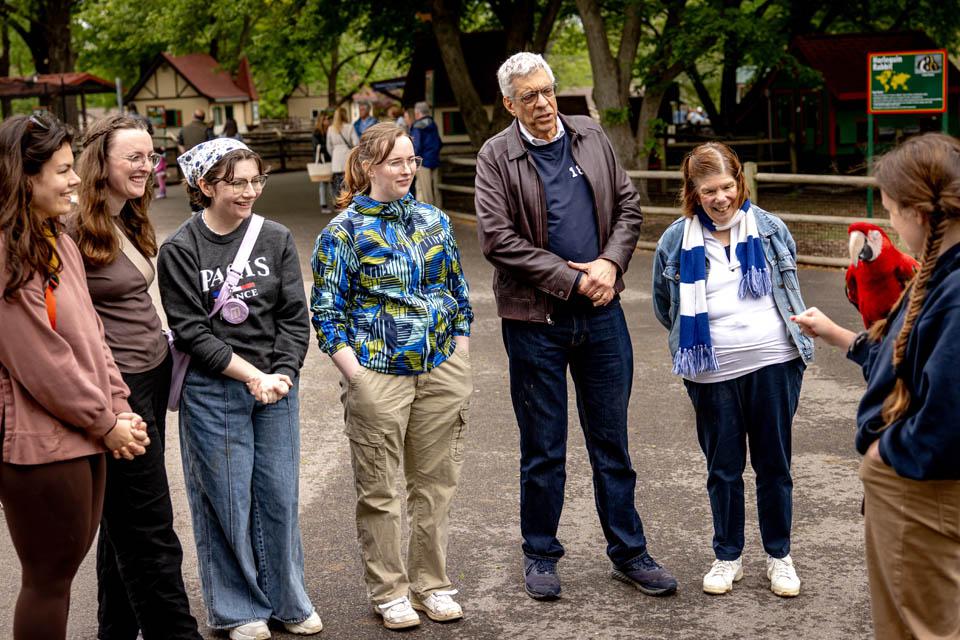 President Fred P. Pestello, Ph.D., and First Lady Fran Pestello, Ph.D., and members of the SLU community learn about the Macaw during a celebration for the Pestellos at Grant’s Farm on April 27, 2025. Photo by Sarah Conroy.