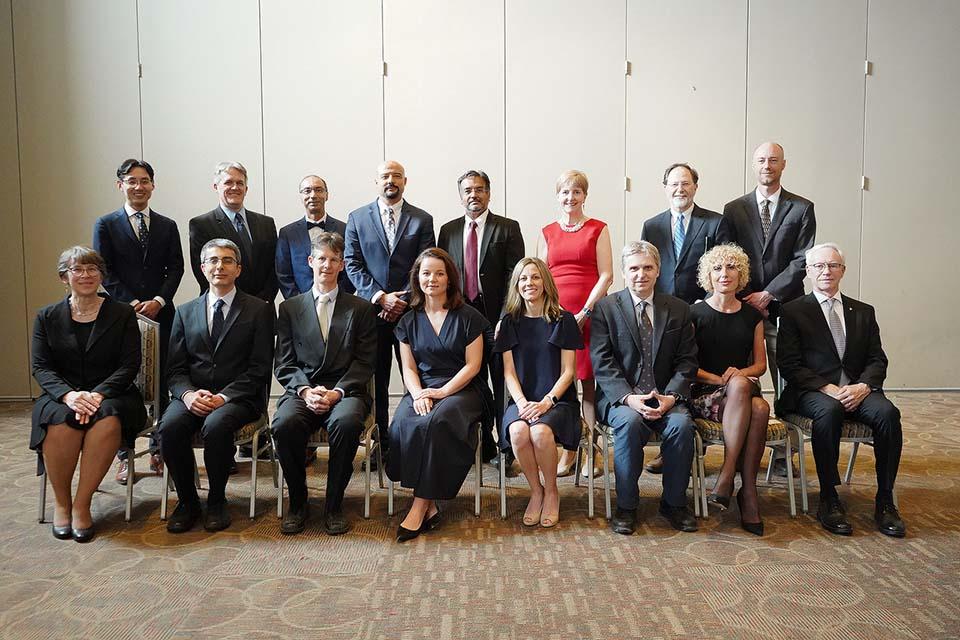 Honorees pose for a group photo at the Investiture Ceremony. 