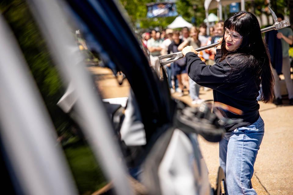 Students hit an old Public Safety car during the Destress with DPS event on May 6, 2025.
Photo by Sarah Conroy.