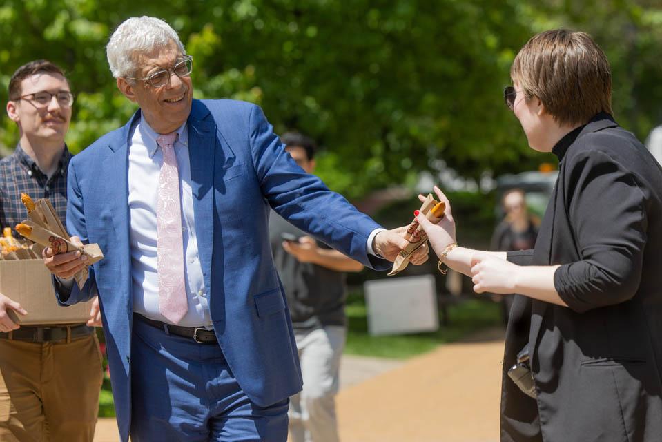President Fred P. Pestello, Ph.D., passes out pretzels to students before the start of final exams on May 6, 2025. Photo by Sarah Conroy.