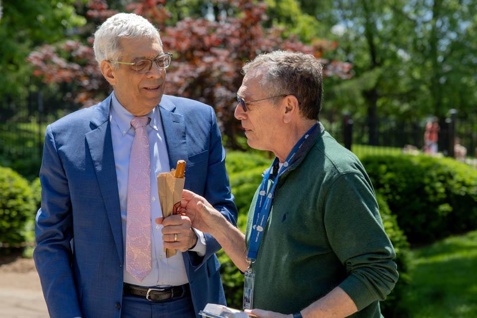 President Fred P. Pestello, Ph.D., passes out pretzels on May 6, 2025. Photo by Sarah Conroy.