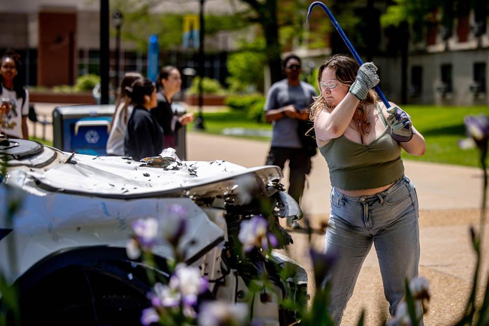 Students hit an old Public Safety car during the Destress with DPS event on May 6, 2025.
Photo by Sarah Conroy.