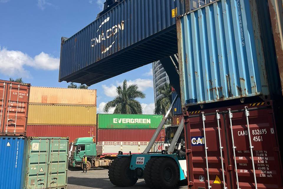 The shipping container of donated pianos is unloaded in Uganda. Submitted photo.