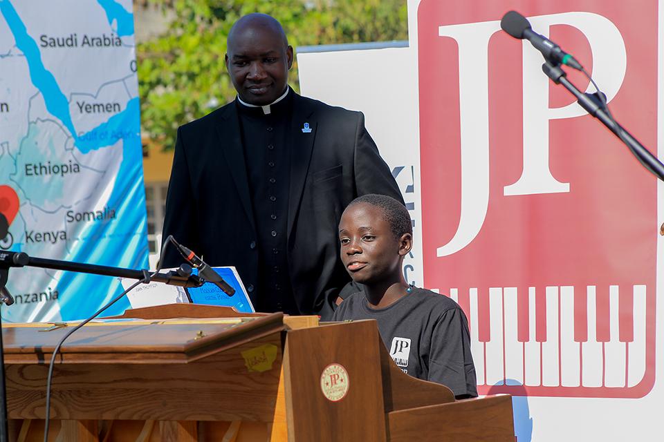 Fr. Thomas Sserwadda, a doctoral student at SLU, instructs a student in piano at the Bukalasa Minor Seminary. Submitted photo.