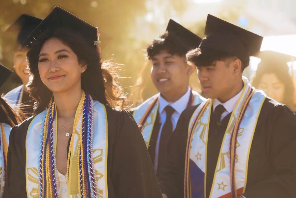 Graduates walk to Chaifetz Arena for Commencement on May 17, 2025. Photo by Sarah Conroy.